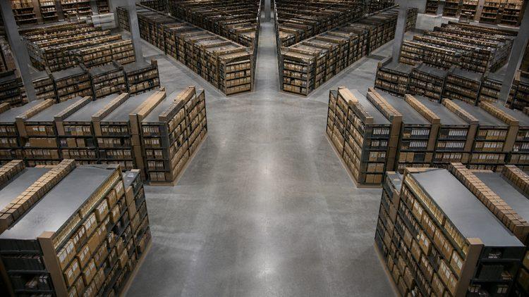 A large archive organized around connected central aisles