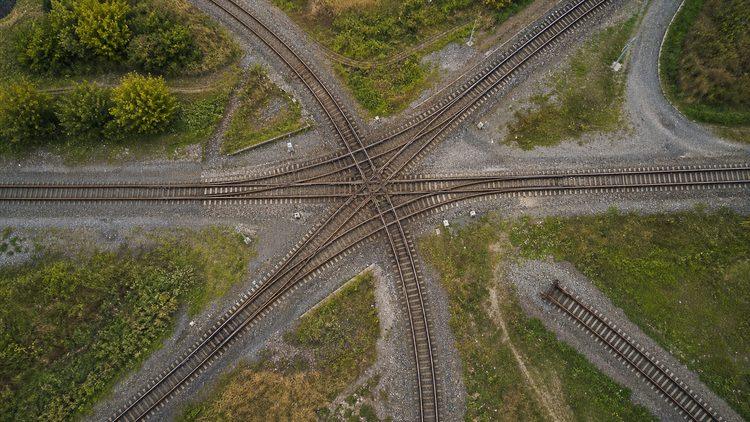 Branching railway tracks converge at a central junction